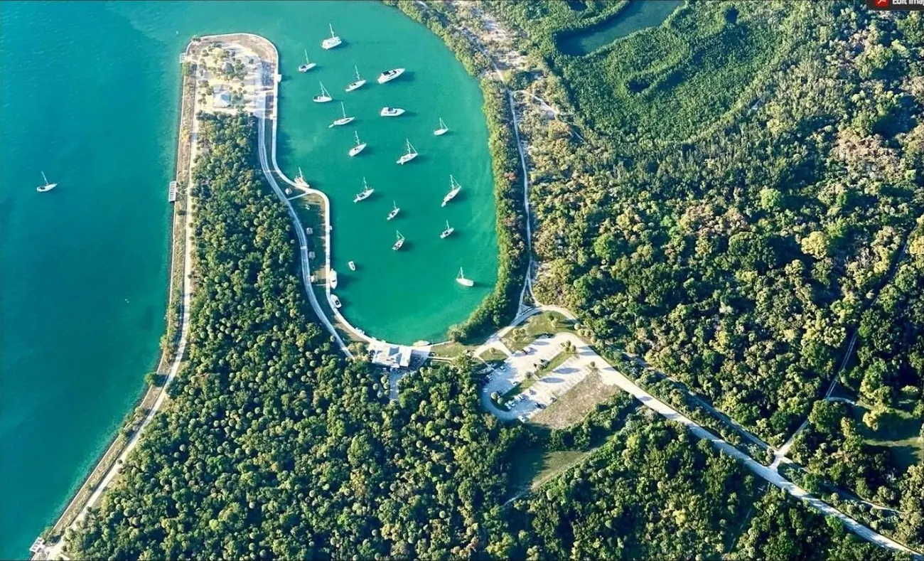 Aerial view of a bayfront marina surrounded by mangroves and hardwood hammock